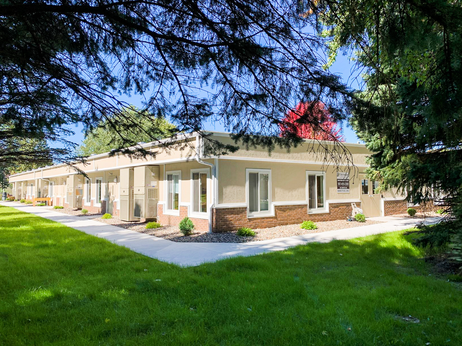 Man Using Measuring Tape in Factory Setting Man Using Measuring Tape in Factory Setting